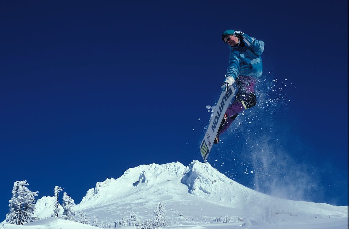 Skiers gliding down snow-covered slopes at Mt Buller snow trip